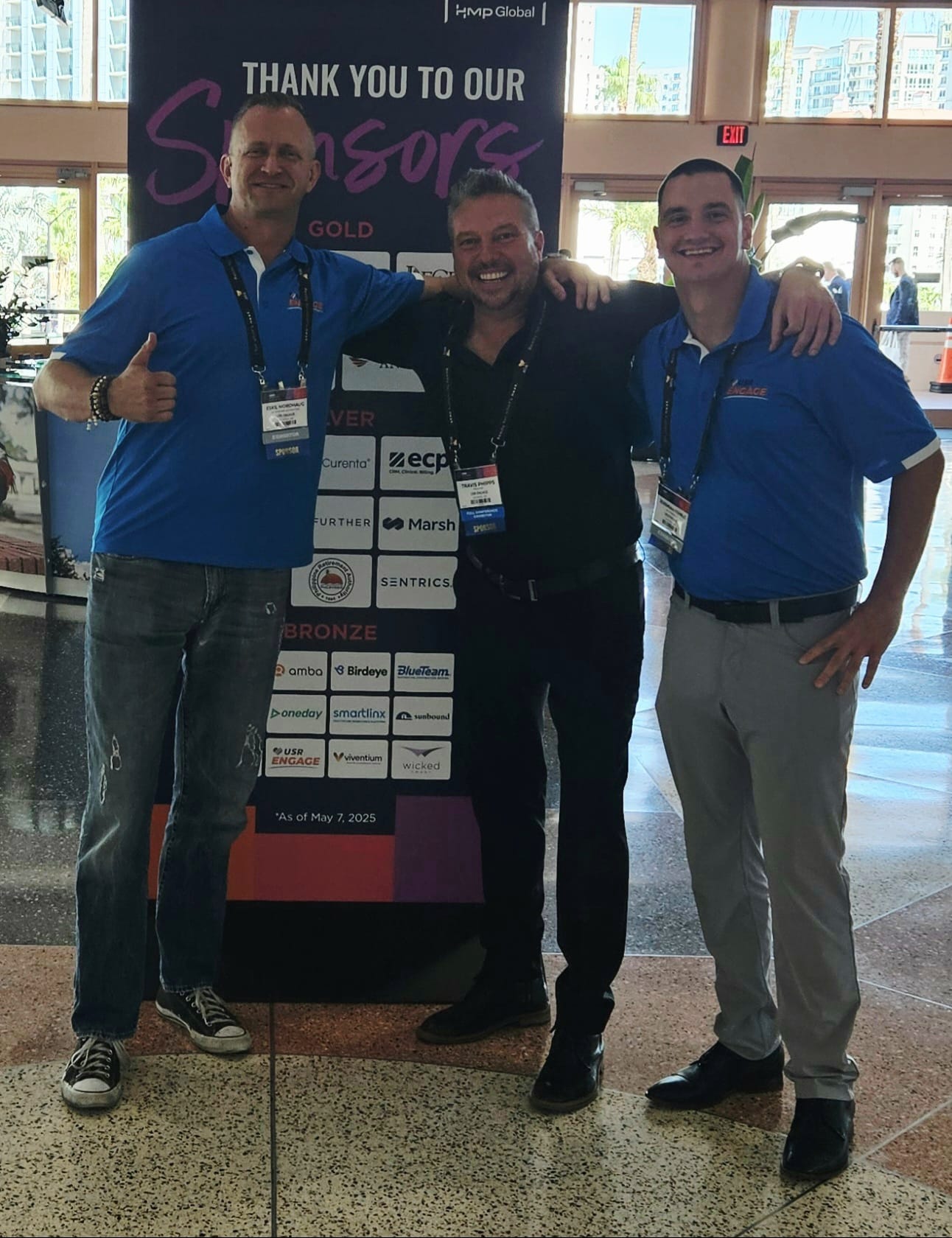 USR Engage team at conference sponsor board